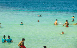 Jolly Buoy Beach with tiny waist high shallow turquoise lagoon attached to it. Andaman Tour Packages by SetMyTrip