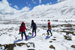 Children Playing with Snow at Zero Point (Lachung): Darjeeling Sikkim Snow Package